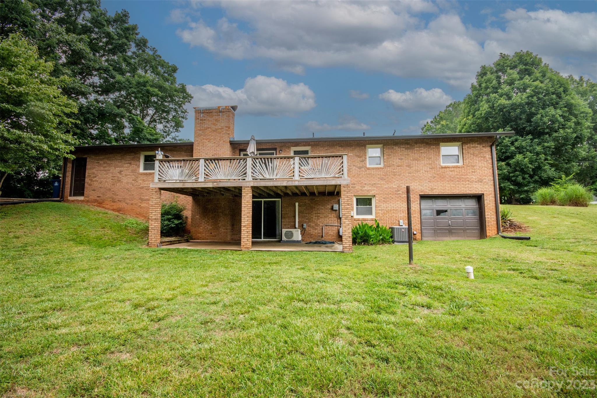 357 Pop Davis Road Taylorsville, NC 28681 - Photo 40 of 45 a view of a house with a yard and a garage