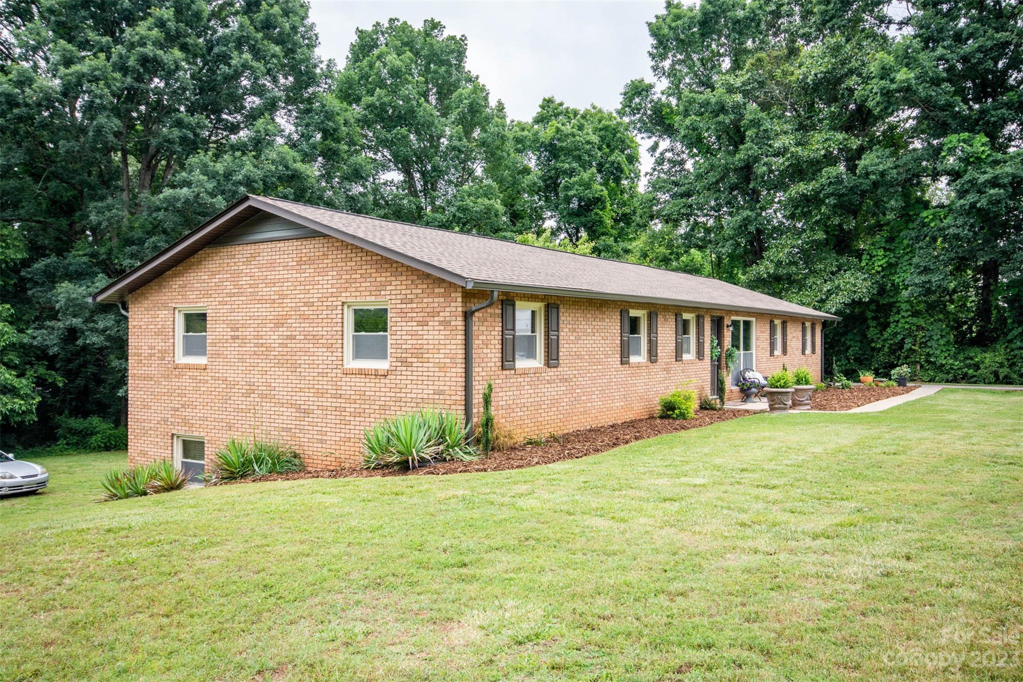 357 Pop Davis Road Taylorsville, NC 28681 - Photo 4 of 45 a view of a house with a yard