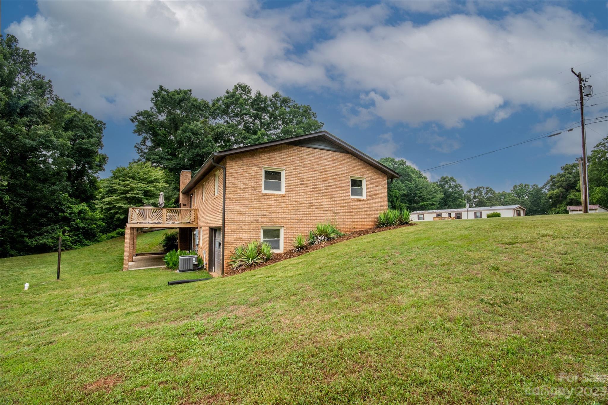 357 Pop Davis Road Taylorsville, NC 28681 - Photo 42 of 45 a view of backyard with garden and entertaining space
