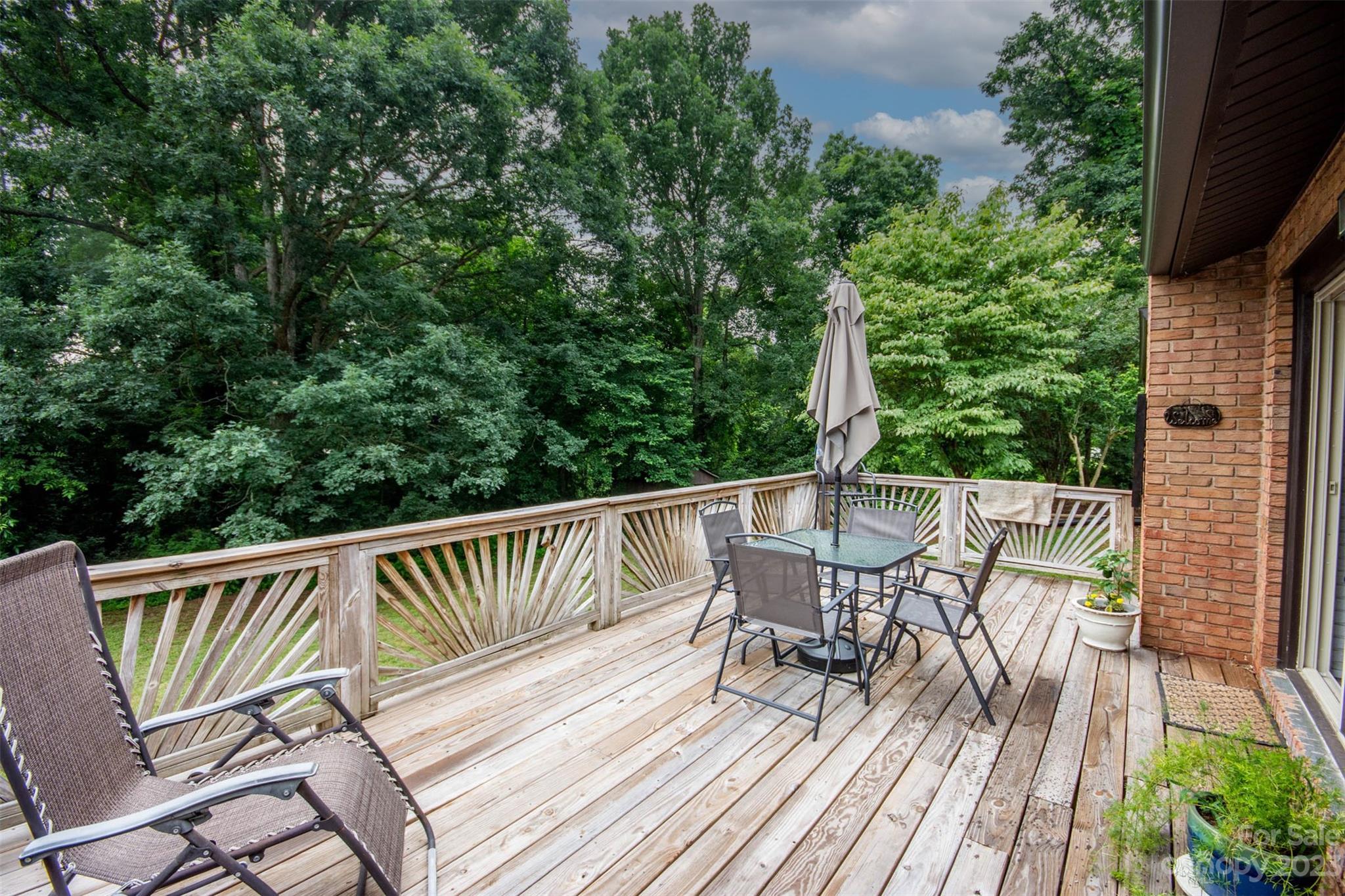 357 Pop Davis Road Taylorsville, NC 28681 - Photo 44 of 45 a view of a deck with a table and chairs with wooden floor and fence