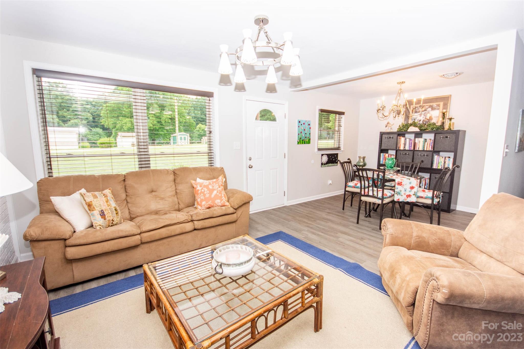 357 Pop Davis Road Taylorsville, NC 28681 - Photo 8 of 45 a living room with furniture and a chandelier