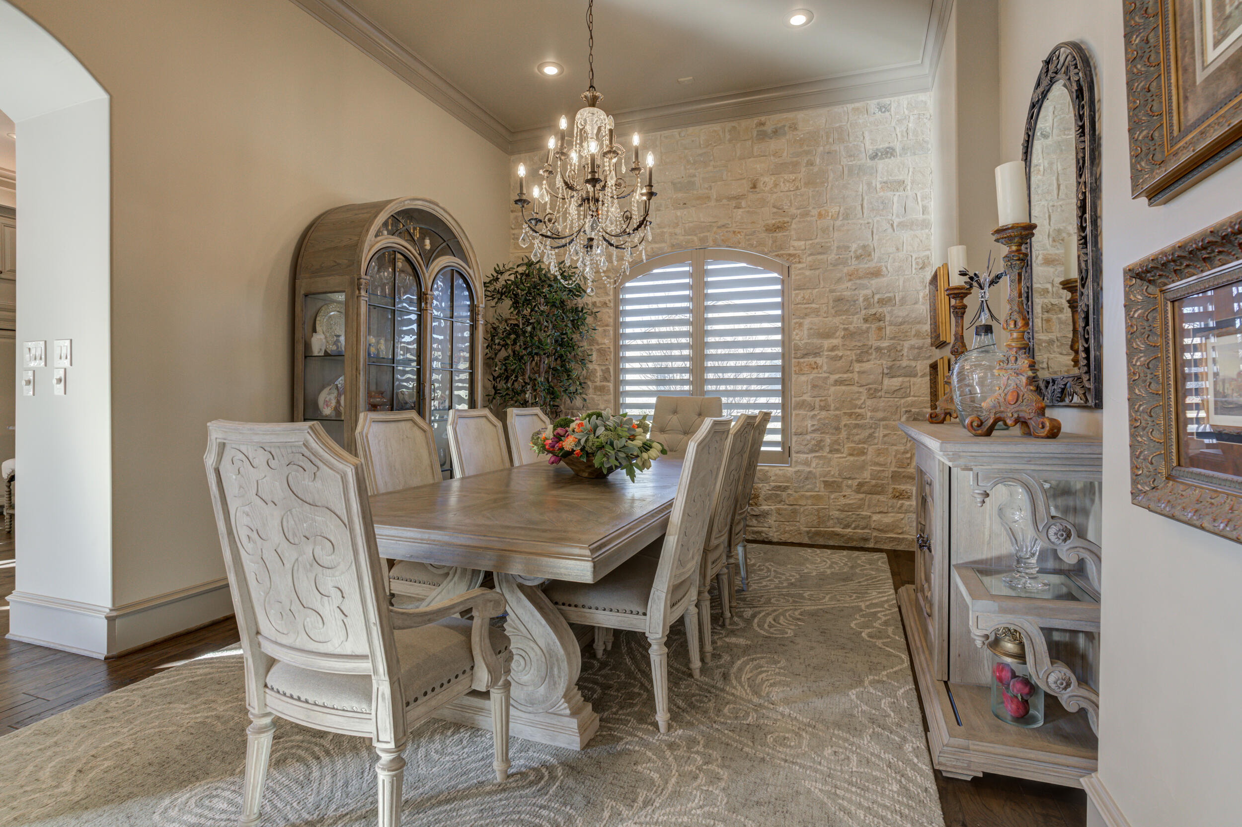 4815 119th Street Lubbock, TX 79424 - Photo 13 of 74 a view of a dining room with furniture and chandelier