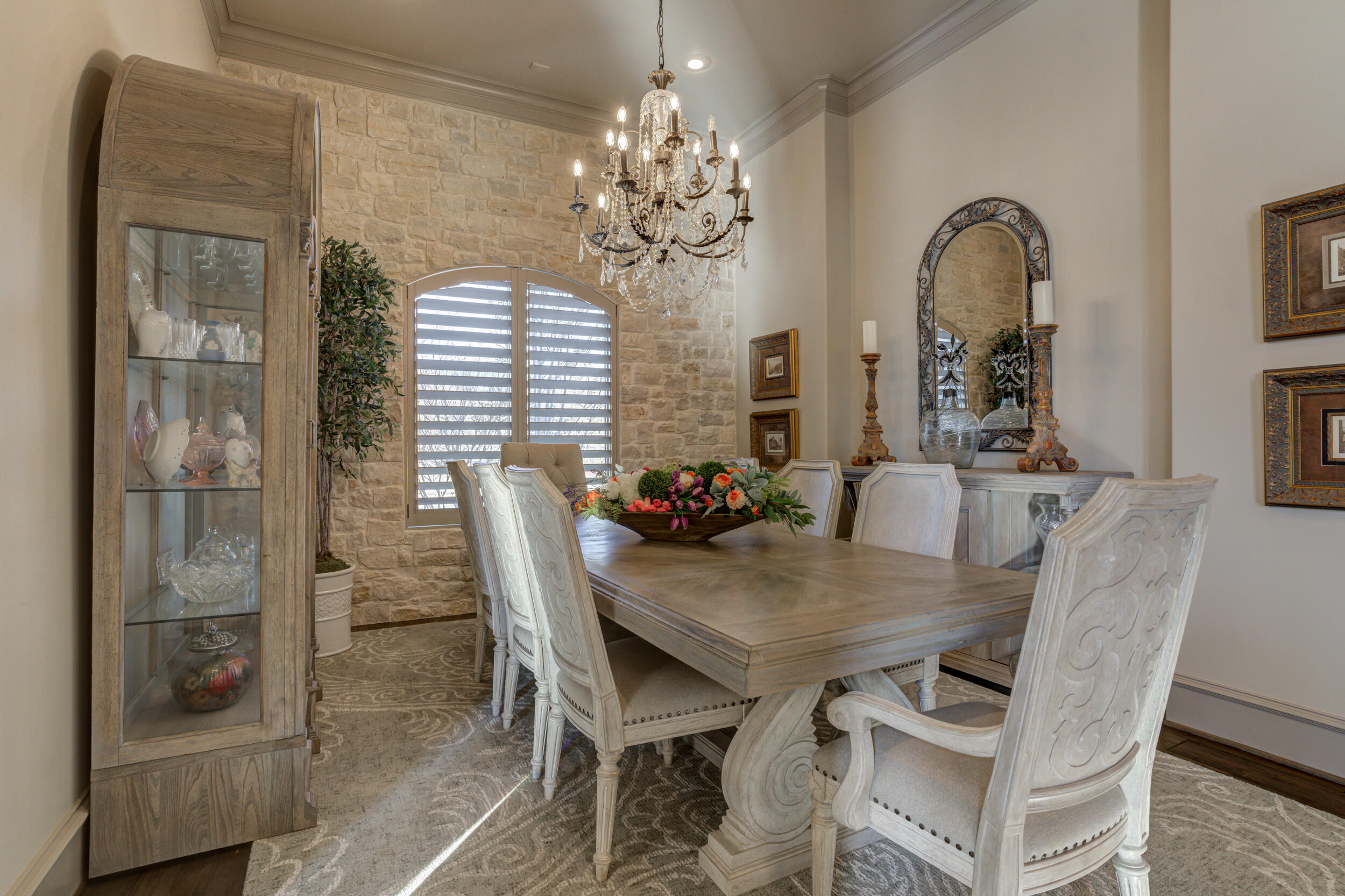 4815 119th Street Lubbock, TX 79424 - Photo 14 of 74 a view of a dining room with furniture and chandelier