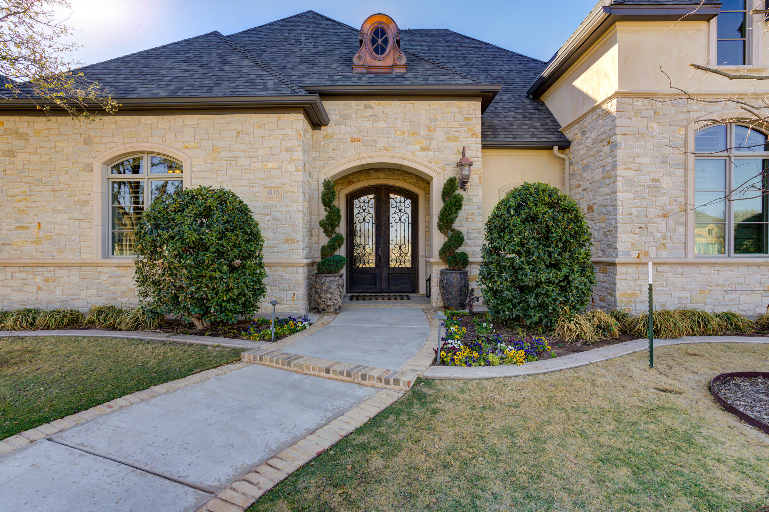 4815 119th Street Lubbock, TX 79424 - Photo 2 of 74 a front view of a house with garden