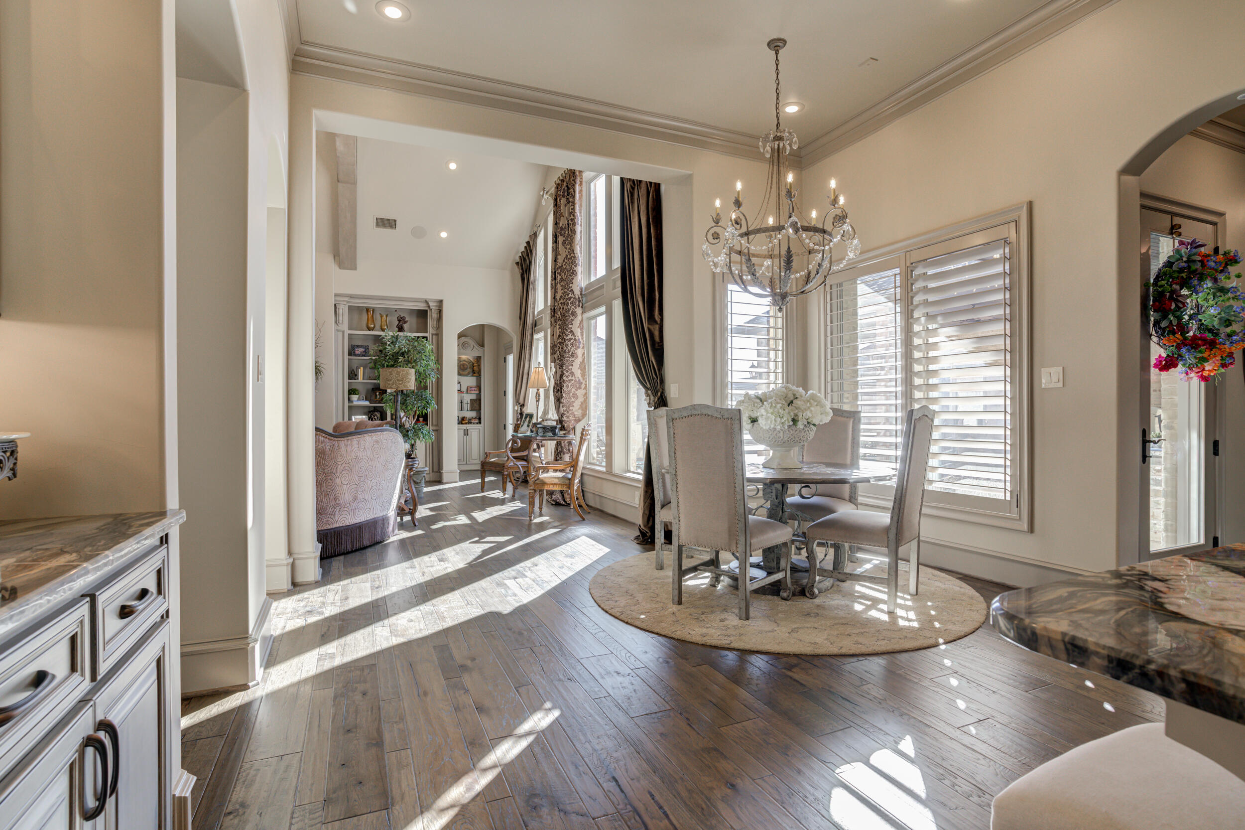 4815 119th Street Lubbock, TX 79424 - Photo 26 of 74 a view of a dining room with furniture wooden floor and chandelier