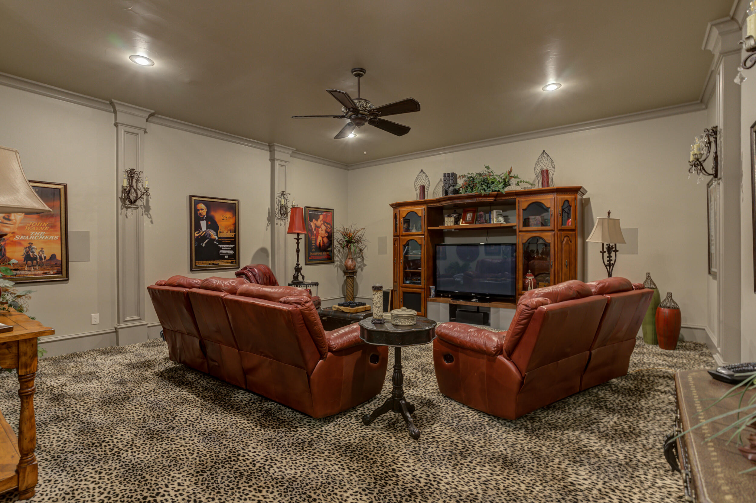 4815 119th Street Lubbock, TX 79424 - Photo 46 of 74 a living room with furniture and a flat screen tv