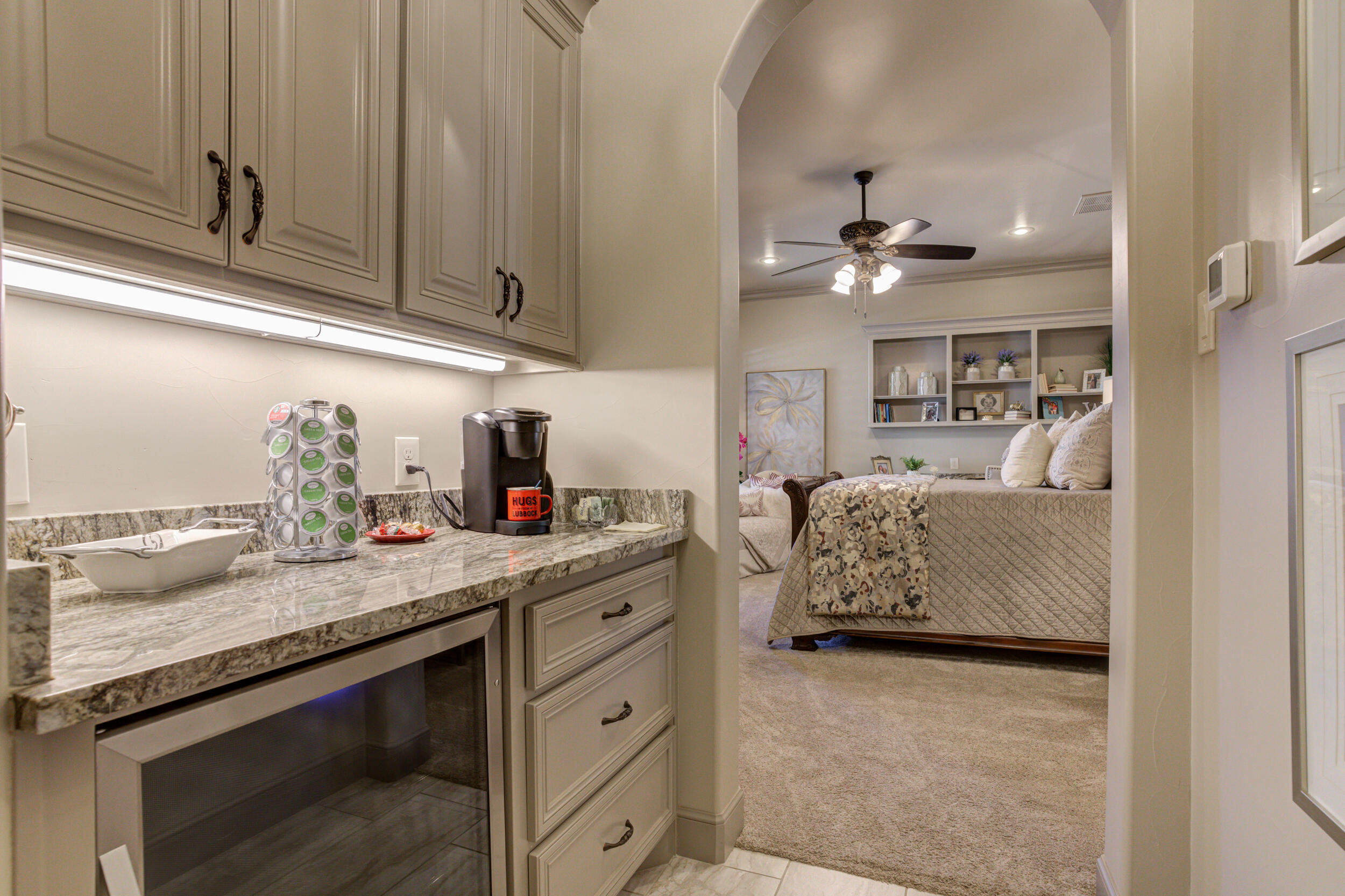 4815 119th Street Lubbock, TX 79424 - Photo 58 of 74 a living room with granite countertop furniture and a fireplace