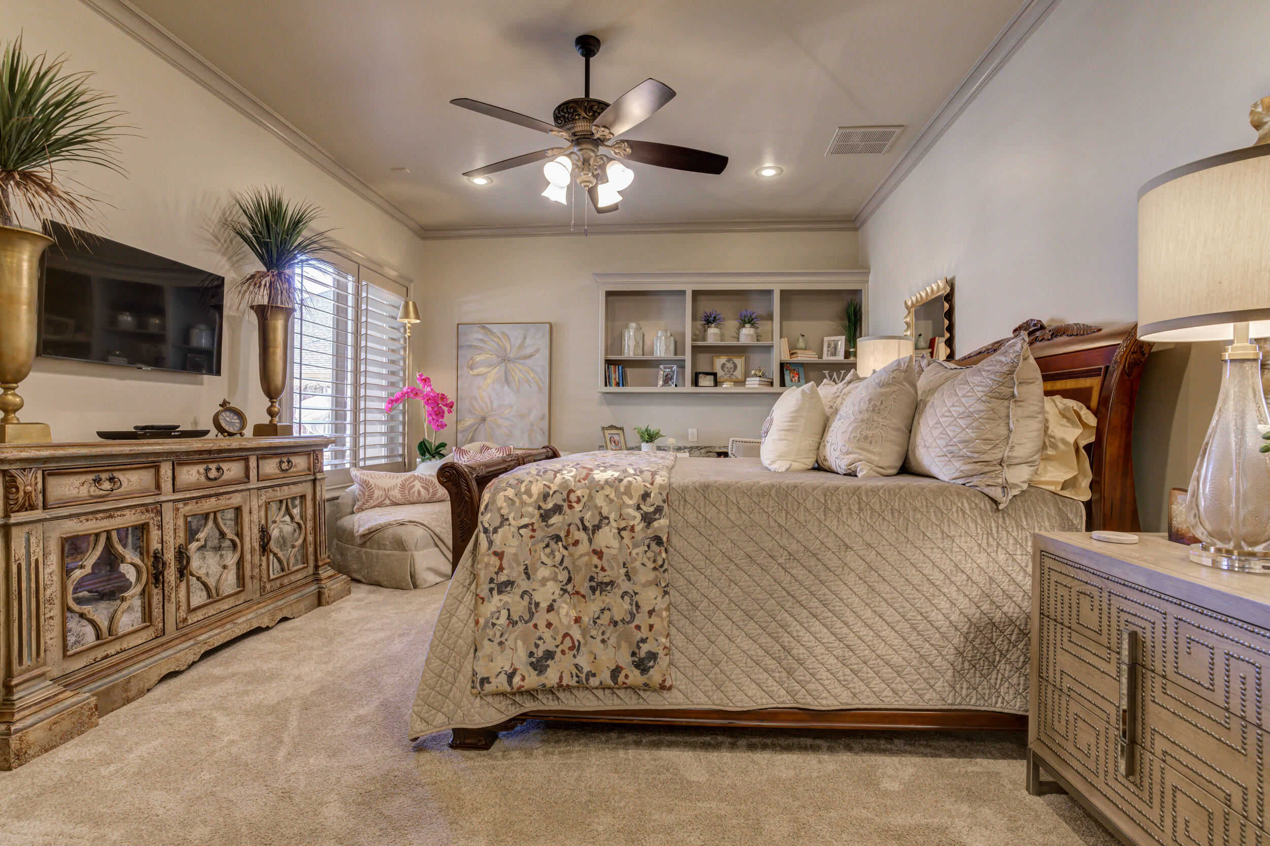 4815 119th Street Lubbock, TX 79424 - Photo 59 of 74 a bedroom with a bed a flat screen tv and dresser