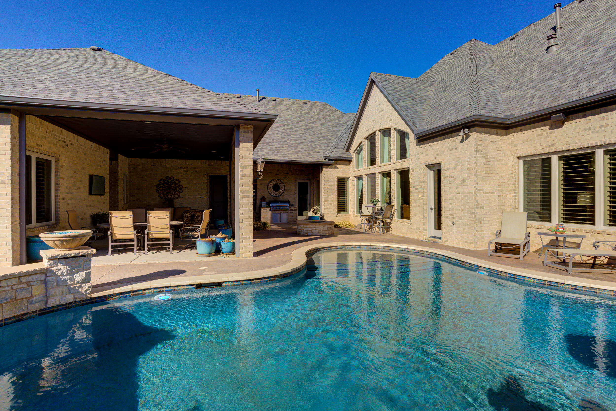4815 119th Street Lubbock, TX 79424 - Photo 67 of 74 a view of a house with swimming pool and sitting area