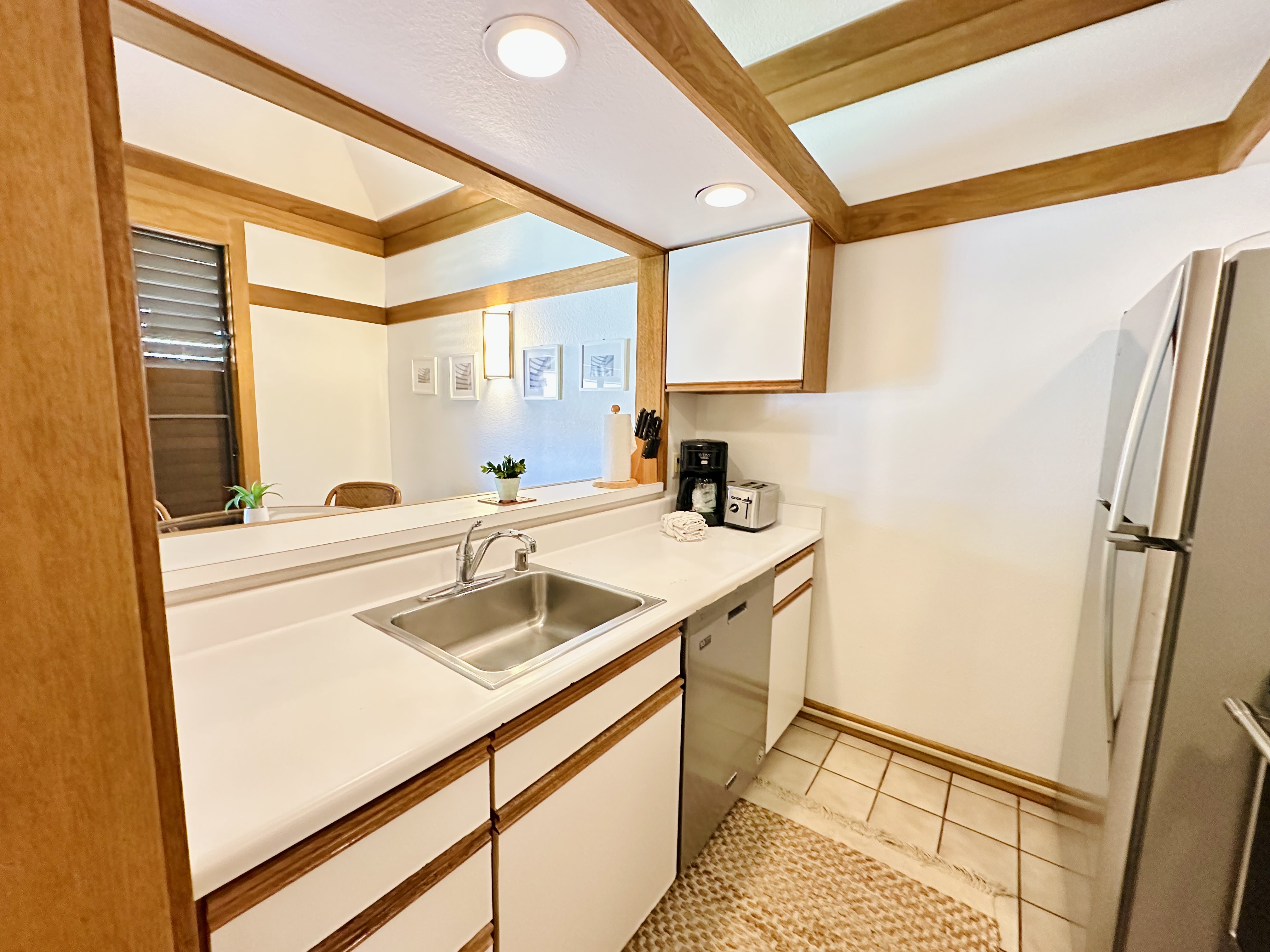 2253 Poipu Road, Unit 446 Koloa, HI 96756 - Photo 7 of 16 a bathroom with a sink and a window