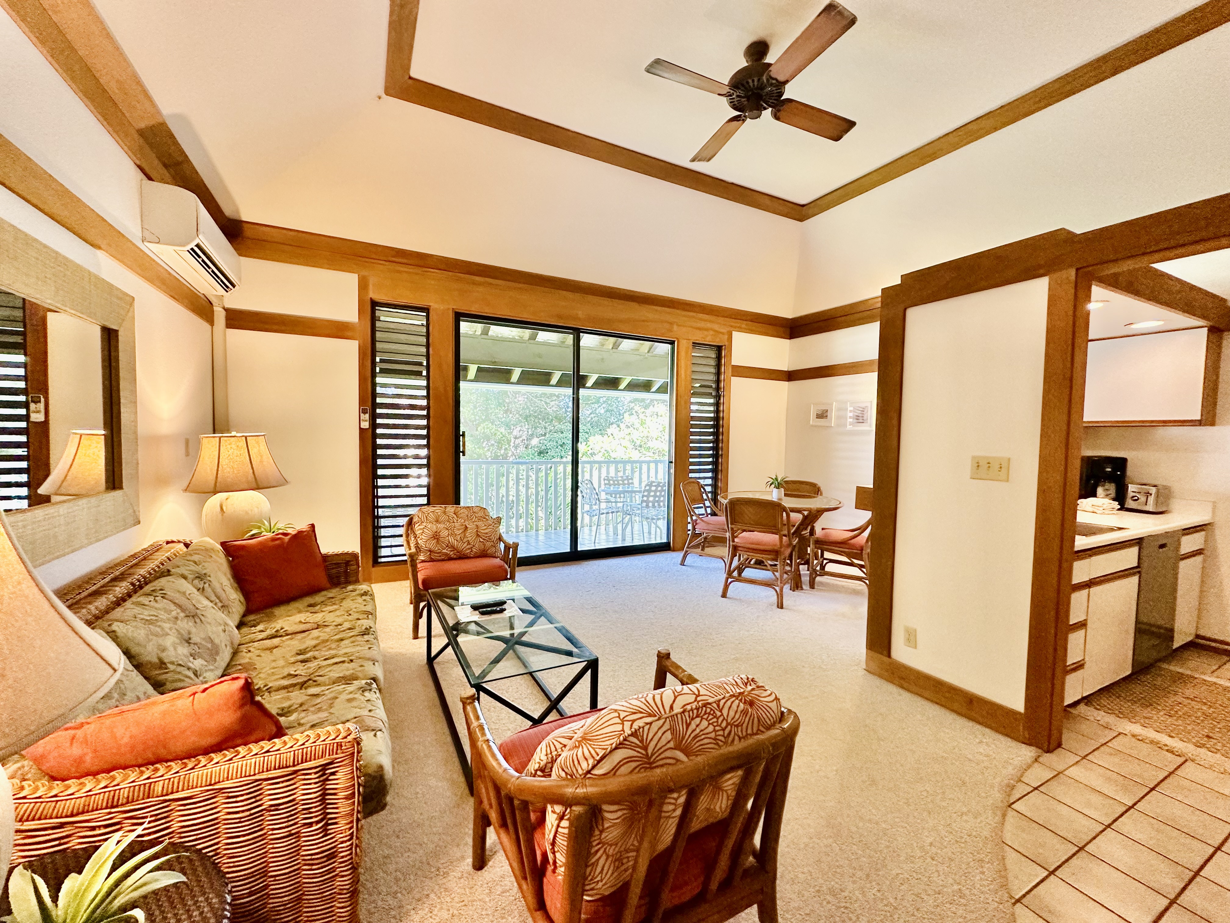 2253 Poipu Road, Unit 446 Koloa, HI 96756 - Photo 10 of 16 a living room with furniture and floor to ceiling windows