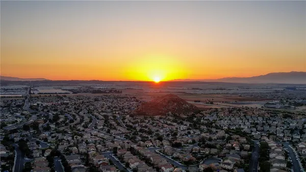 an aerial view of residential house and green space