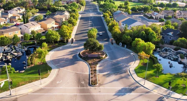 an aerial view of residential houses with outdoor space