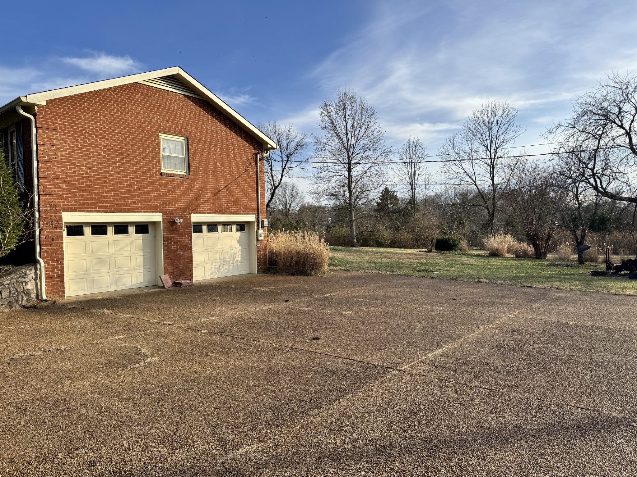 9209 Concord Road Brentwood, TN 37027 - Photo 4 of 4 a front view of a house with a yard and garage
