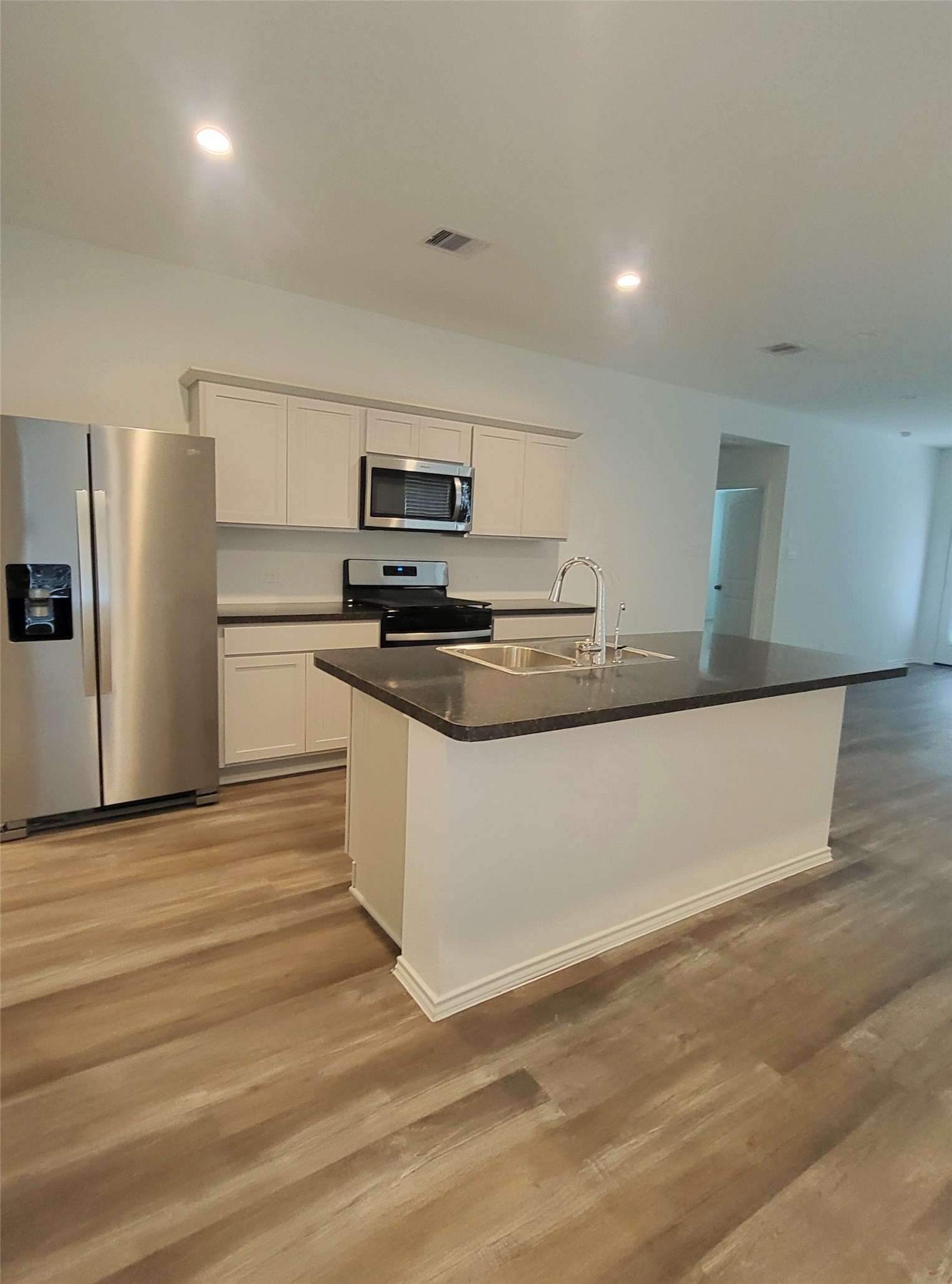 23835 Sunland Park Spring, TX 77373 - Photo 2 of 14 Sleek contemporary kitchen equipped with stainless steel appliances.