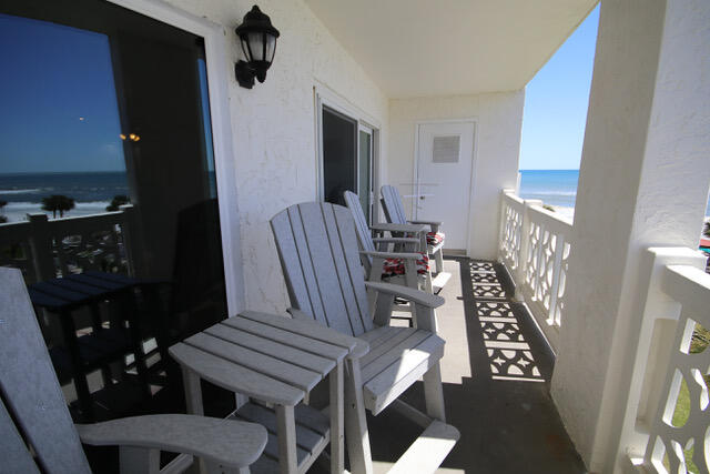 909 Santa Rosa Boulevard, Unit 355 Fort Walton Beach, FL 32548 - Photo 11 of 17 a view of a livingroom with furniture a rug and wooden floor
