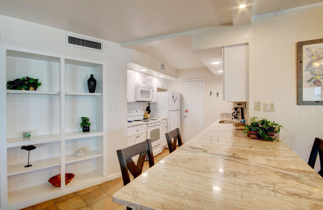 909 Santa Rosa Boulevard, Unit 355 Fort Walton Beach, FL 32548 - Photo 3 of 17 a large white room with cabinets