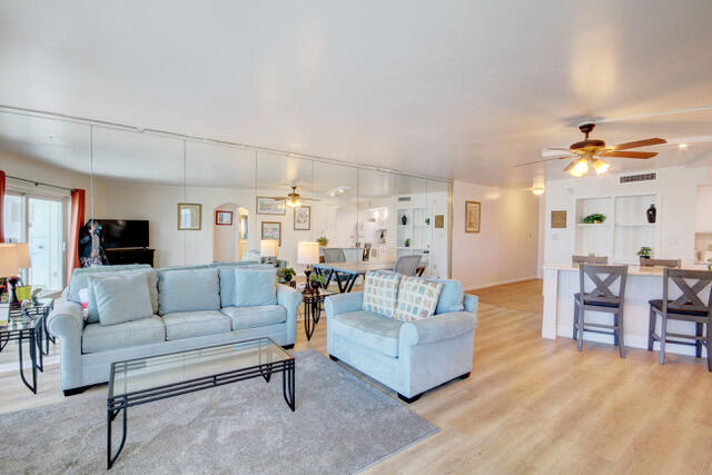 909 Santa Rosa Boulevard, Unit 355 Fort Walton Beach, FL 32548 - Photo 7 of 17 a living room with furniture and view of kitchen