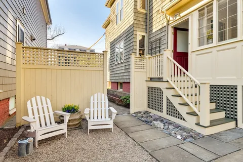 a view of stairs with a bench