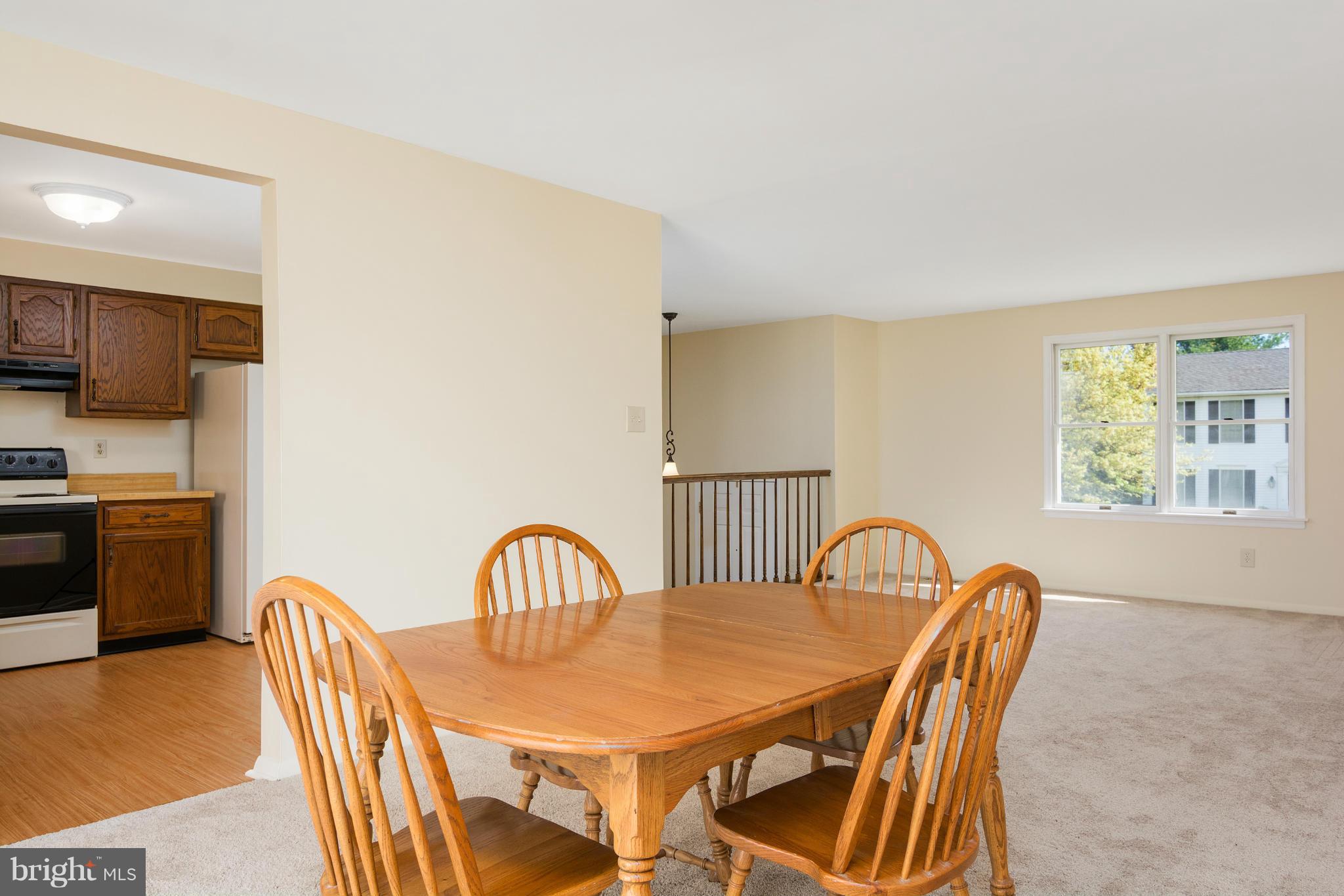 9005 Throgmorton Road Baltimore, MD 21234 - Photo 11 of 30 a view of a dining room with furniture and a window
