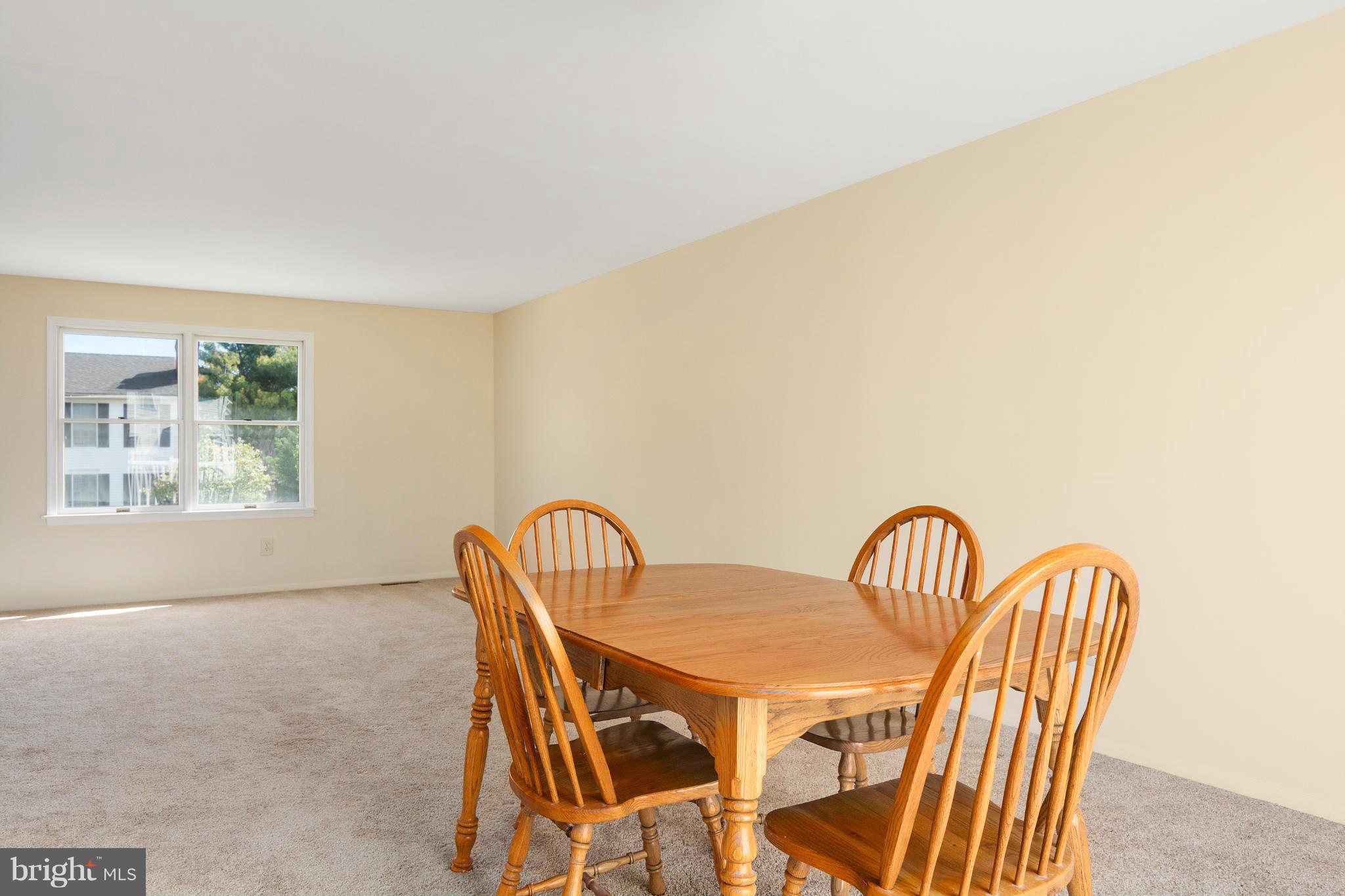 9005 Throgmorton Road Baltimore, MD 21234 - Photo 12 of 30 a view of a dining room with furniture and window