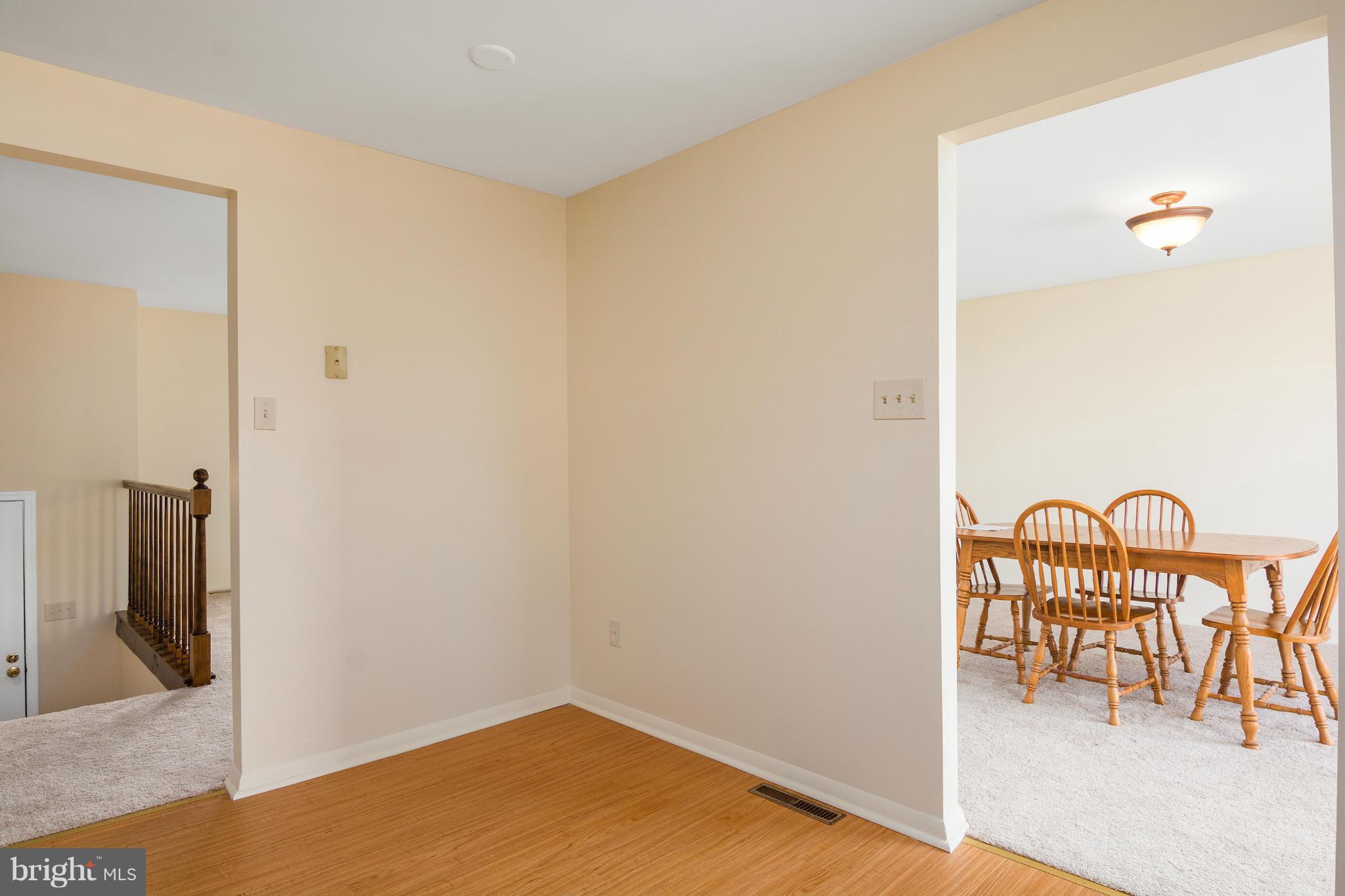 9005 Throgmorton Road Baltimore, MD 21234 - Photo 16 of 30 a view of a hallway with a potted plant