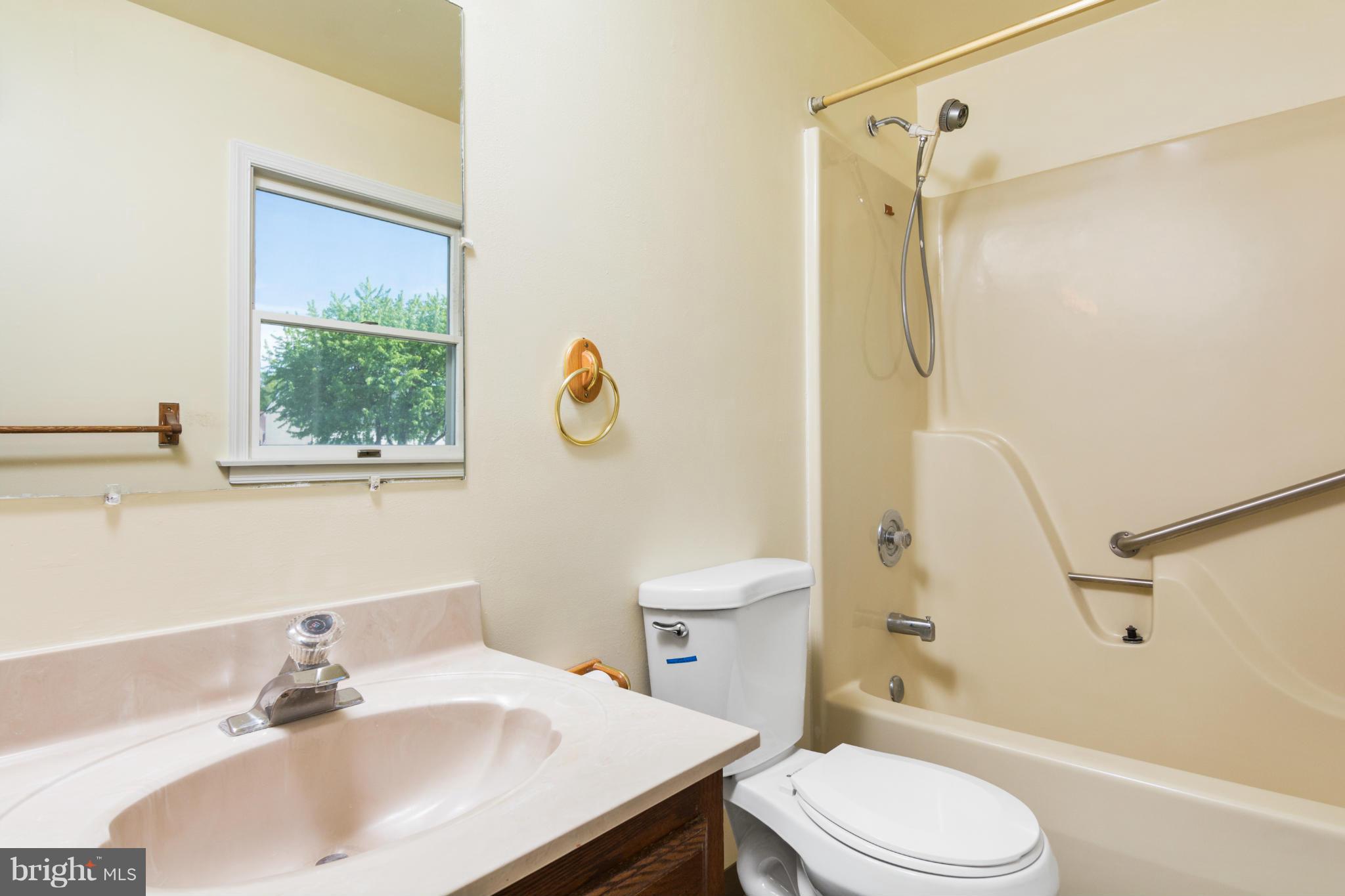 9005 Throgmorton Road Baltimore, MD 21234 - Photo 26 of 30 a bathroom with a sink toilet and shower