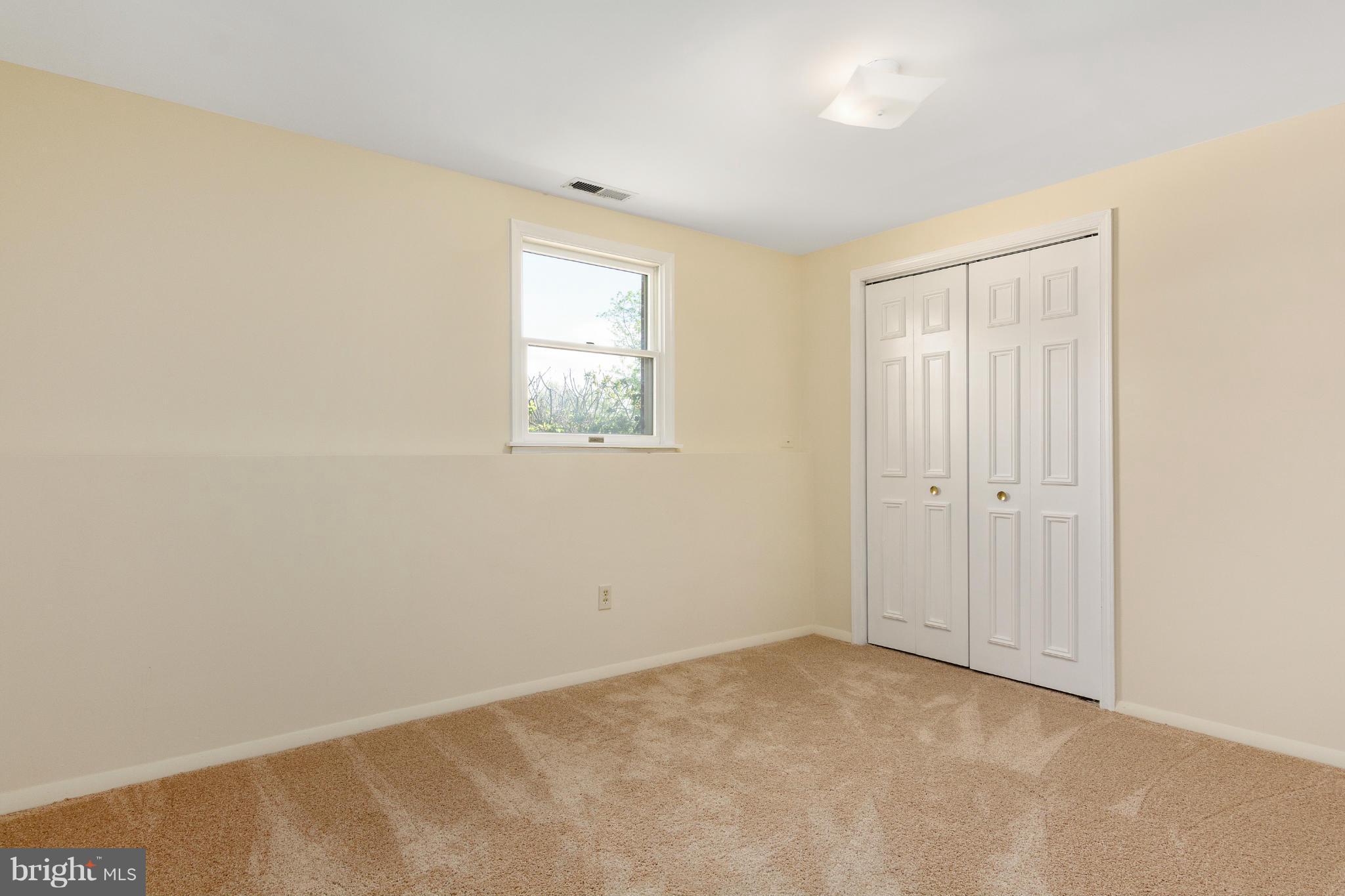 9005 Throgmorton Road Baltimore, MD 21234 - Photo 28 of 30 an empty room with windows