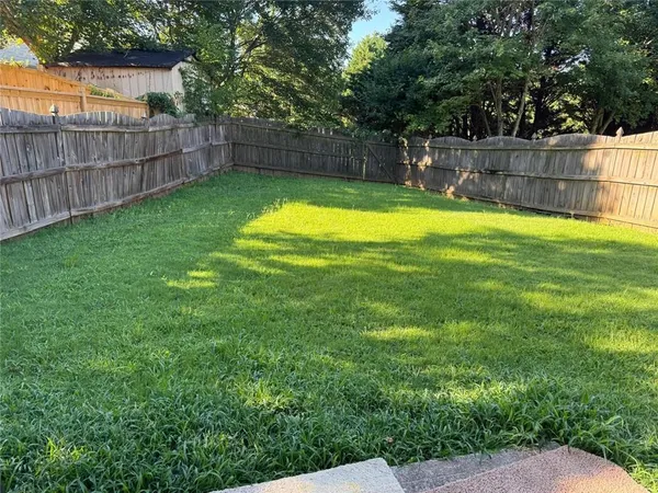 a view of a backyard with potted plants