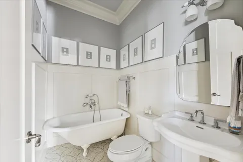 a bathroom with a sink a toilet and a bathtub