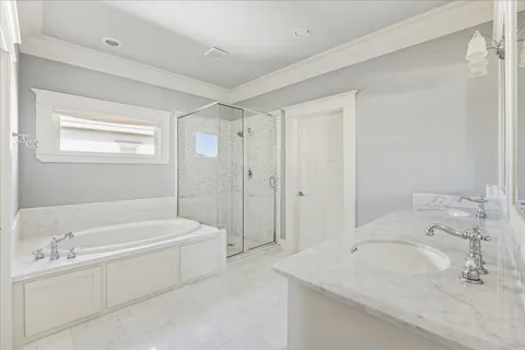 a bathroom with a bathtub and a sink
