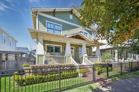 a front view of house with a garden