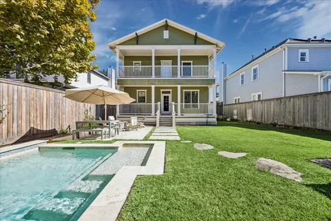a front view of a house with a yard table and chairs