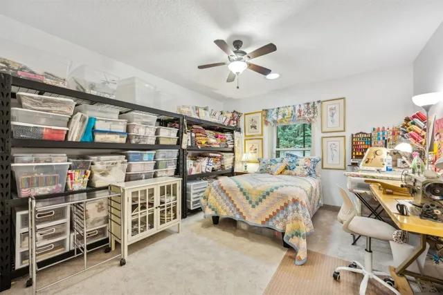 a bedroom with furniture with white walls