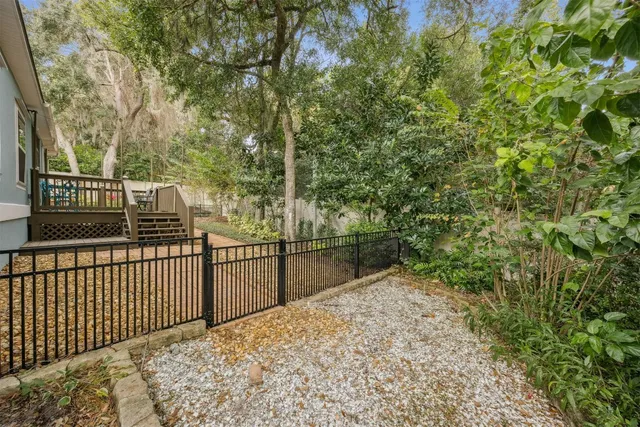 a balcony with trees in front of it