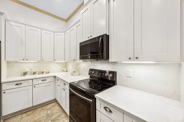 a kitchen with a sink and a stove top oven