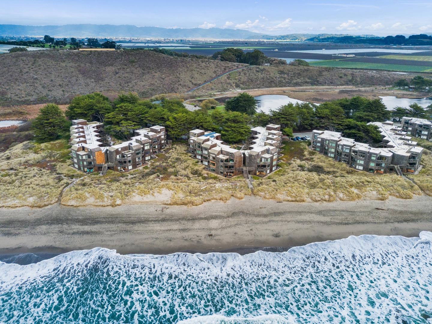 a view of a lake with a yard and mountain view