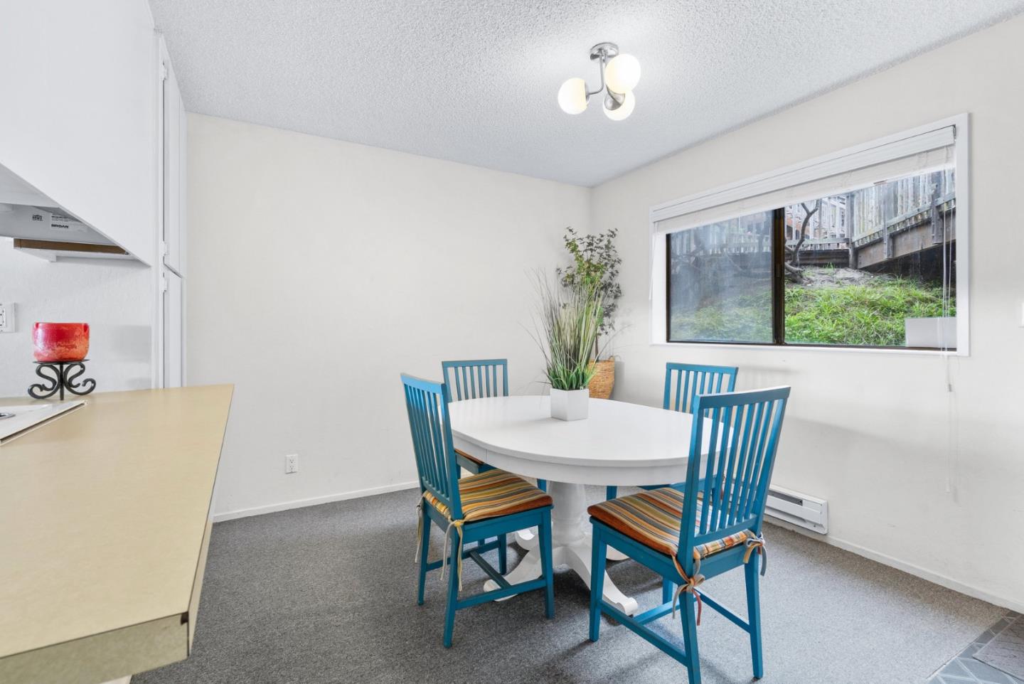 101 Shell Road, Unit 244 Watsonville, CA 95076 - Photo 11 of 32 a view of a dining room with furniture and a potted plant