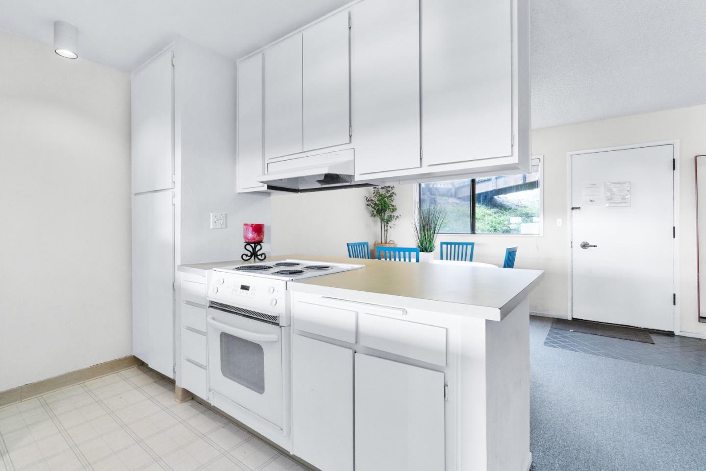 101 Shell Road, Unit 244 Watsonville, CA 95076 - Photo 15 of 32 a kitchen with granite countertop white cabinets and white appliances