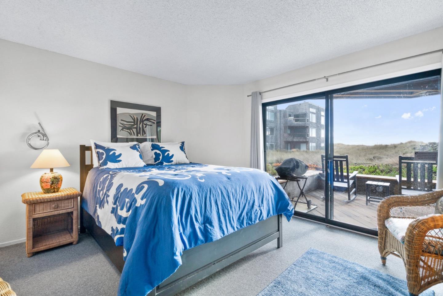 101 Shell Road, Unit 244 Watsonville, CA 95076 - Photo 16 of 32 a bedroom with a bed and glass window