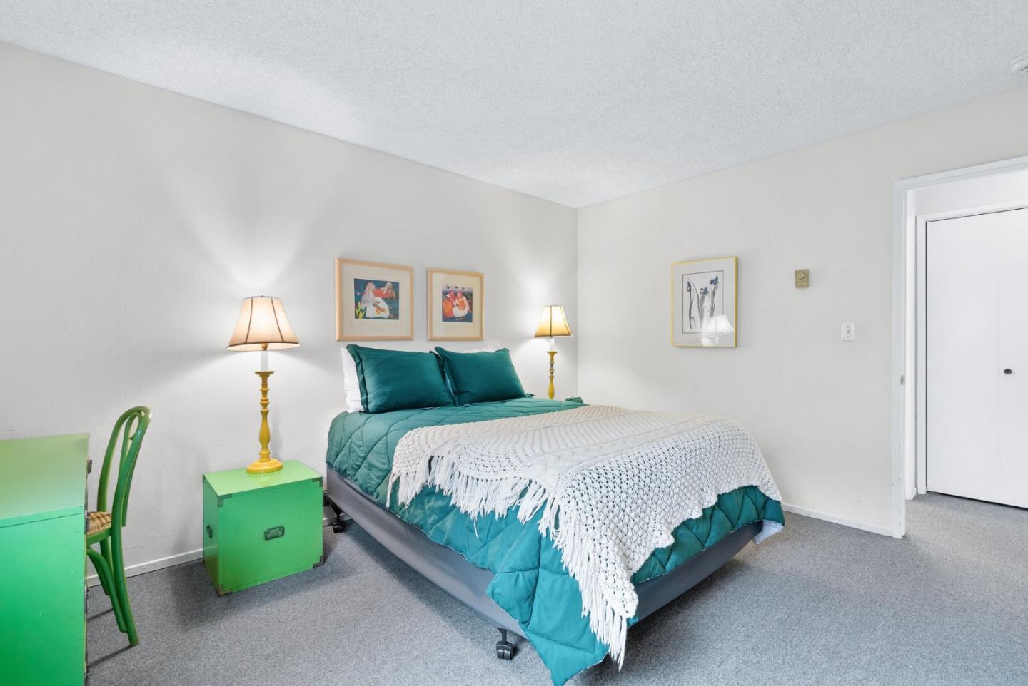 101 Shell Road, Unit 244 Watsonville, CA 95076 - Photo 22 of 32 a bedroom with a bed and a chandelier