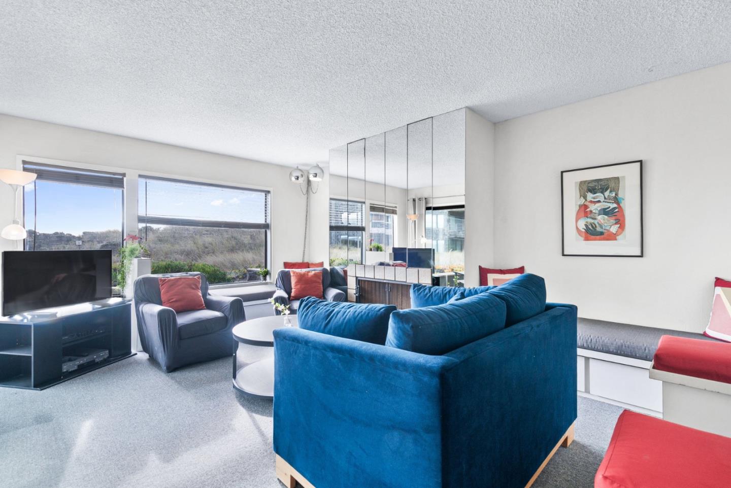 101 Shell Road, Unit 244 Watsonville, CA 95076 - Photo 4 of 32 a living room with furniture a large window and a flat screen tv