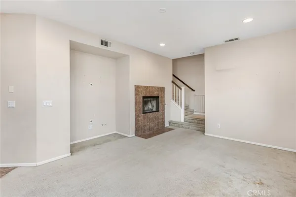 a view of a kitchen with a stove cabinets and a fireplace