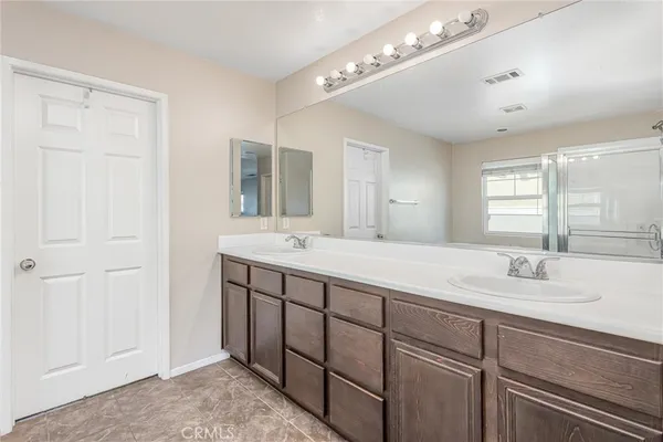 a white bath tub sitting next to a shower