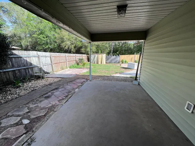 a view of a backyard of the house