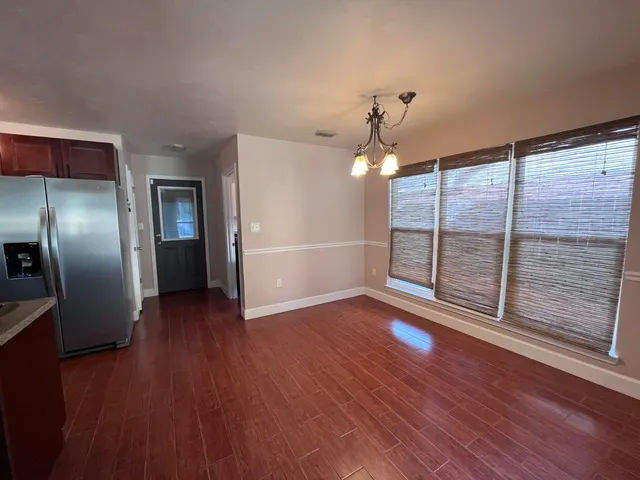 a view of a livingroom with wooden floor