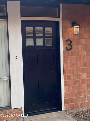 a bathroom with a sink a toilet and shower curtain