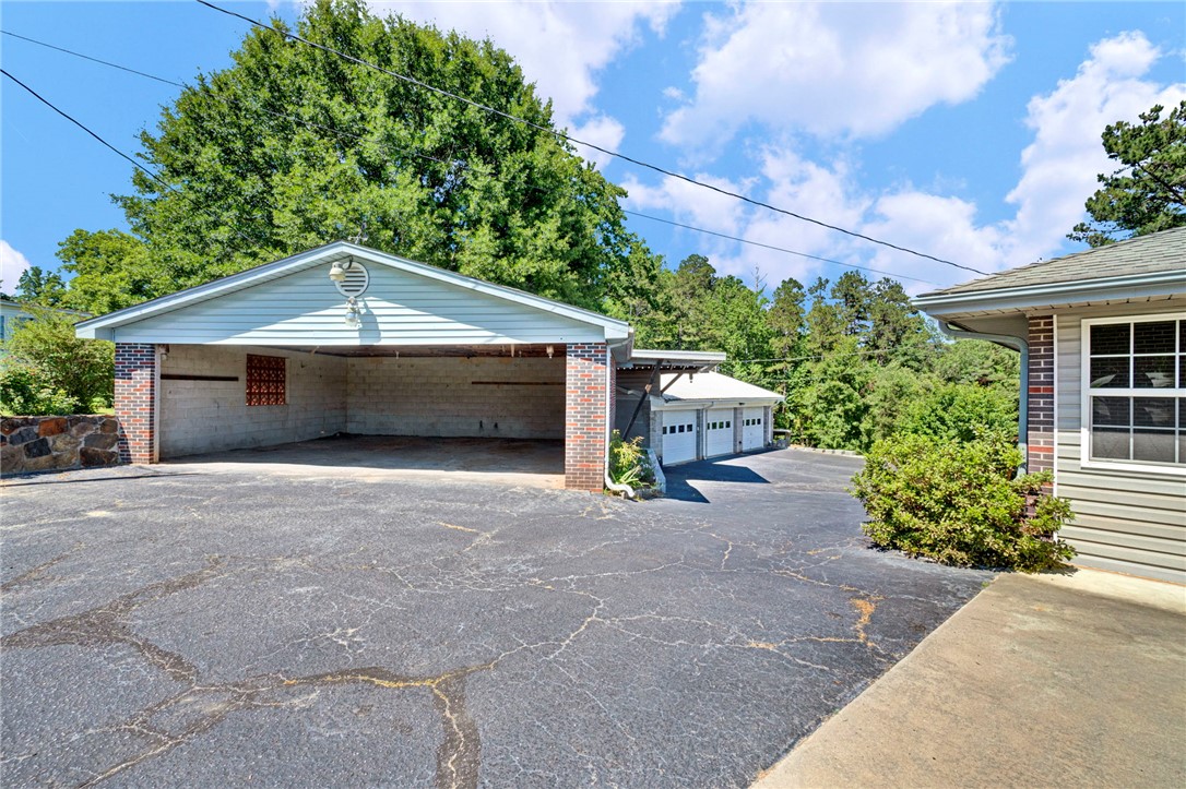 7876 Highway 11 Walhalla, SC 29691 - Photo 10 of 35 Ample parking and storage space await, featuring multiple garages with convenient access.