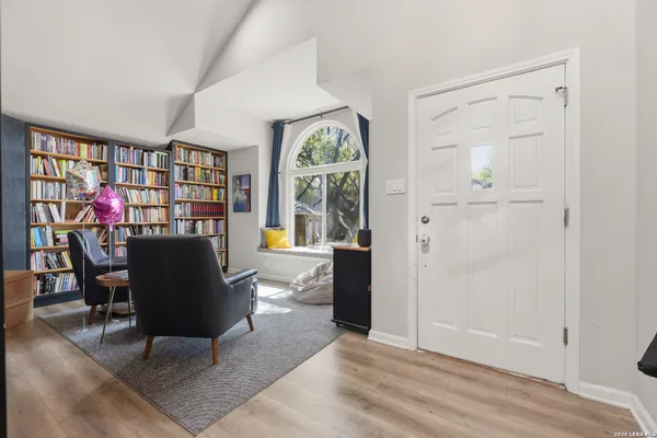 a view of a dining room with furniture and window