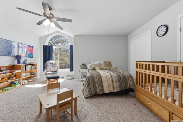 a bedroom with furniture and a window